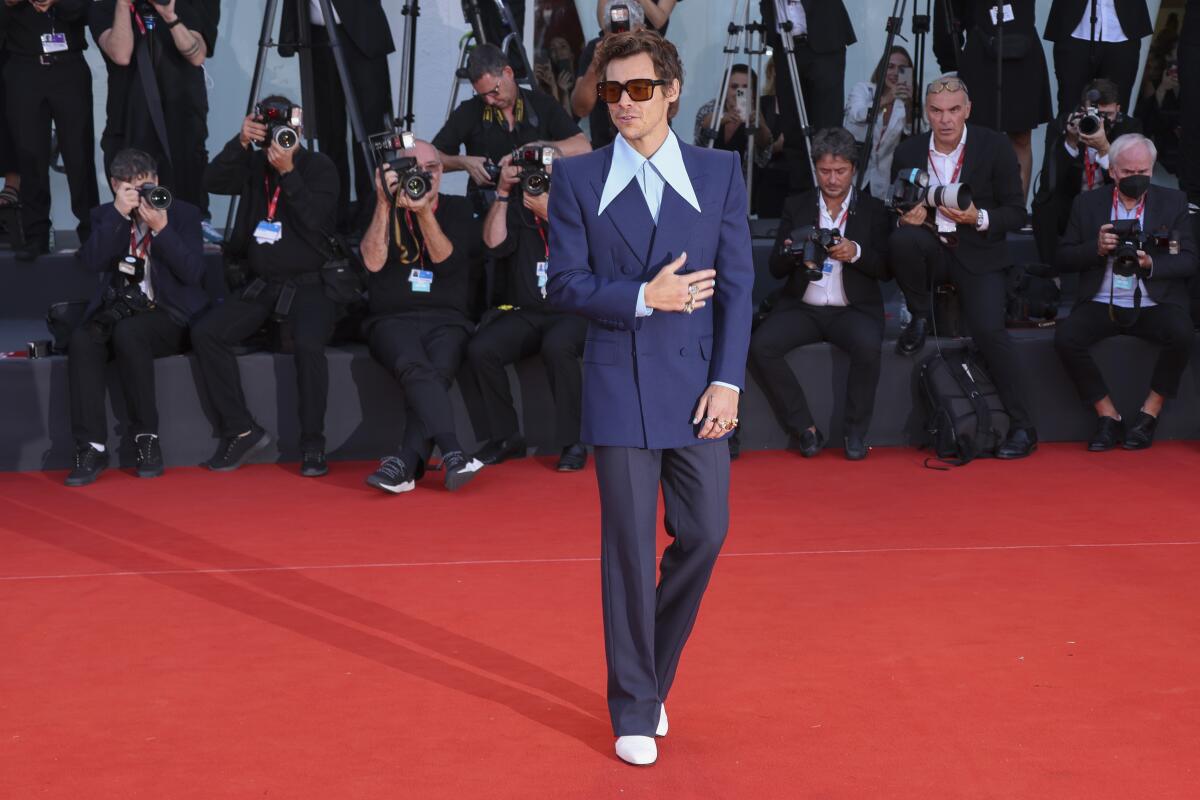 Harry Styles poses for photographers upon arrival at the premiere of the film 'Don't Worry Darling' during the 79th edition of the Venice Film Festival in Venice, Italy, Monday, Sept. 5, 2022. (Photo by Joel C Ryan/Invision/AP)