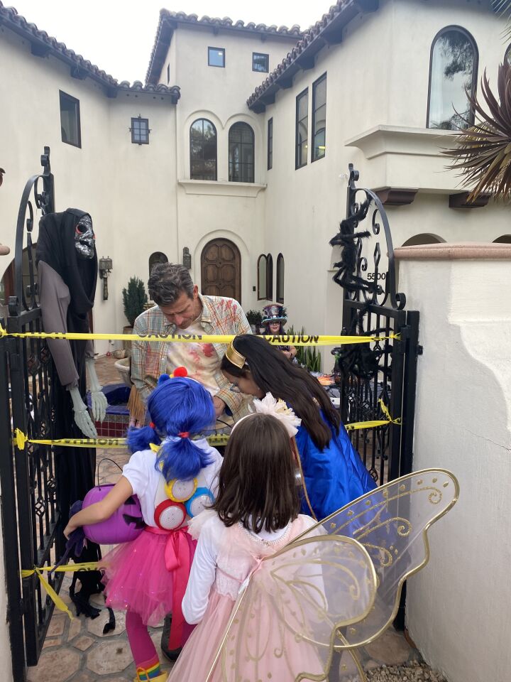 Trick-or-treaters eagerly collect candy in Bird Rock on Halloween.