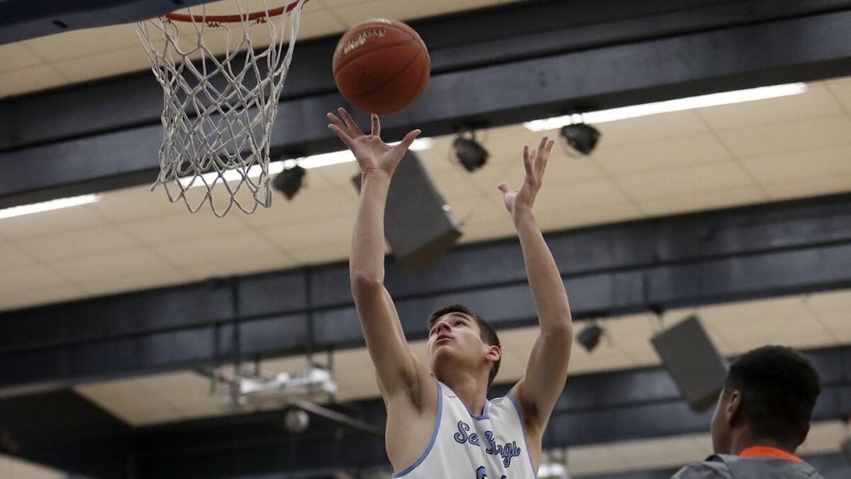 Corona del Mar High's Jack Garza scores against Eastvale Roosevelt during the first half at the CdM Beach Bash on Wednesday.