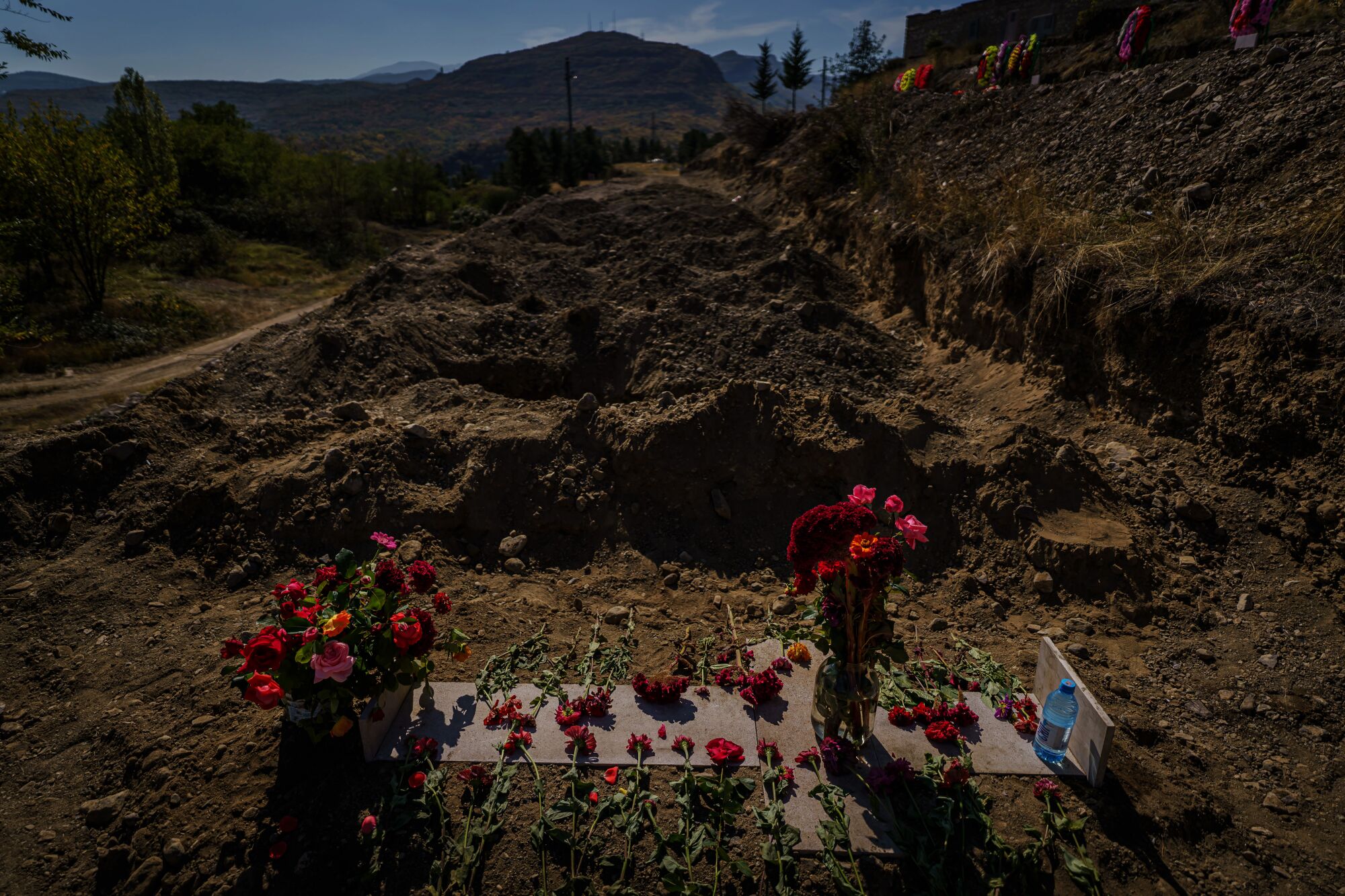 Red flowers adorn a grave at a military cemetery in Stepanakert, Nagorno-Karabakh.