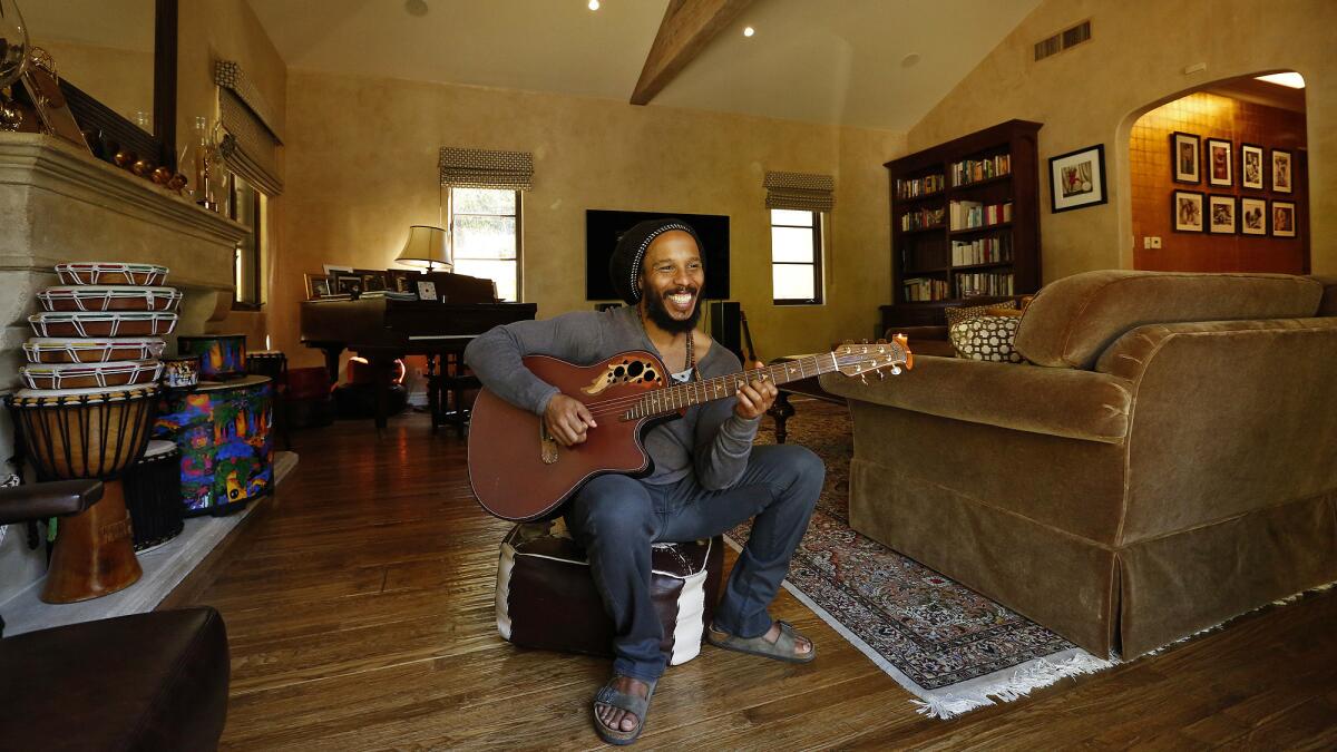 In his library/TV room, Marley says, "my daughter will play the piano, and we jam and make music. We love to watch movies as a family and have a big screen TV."