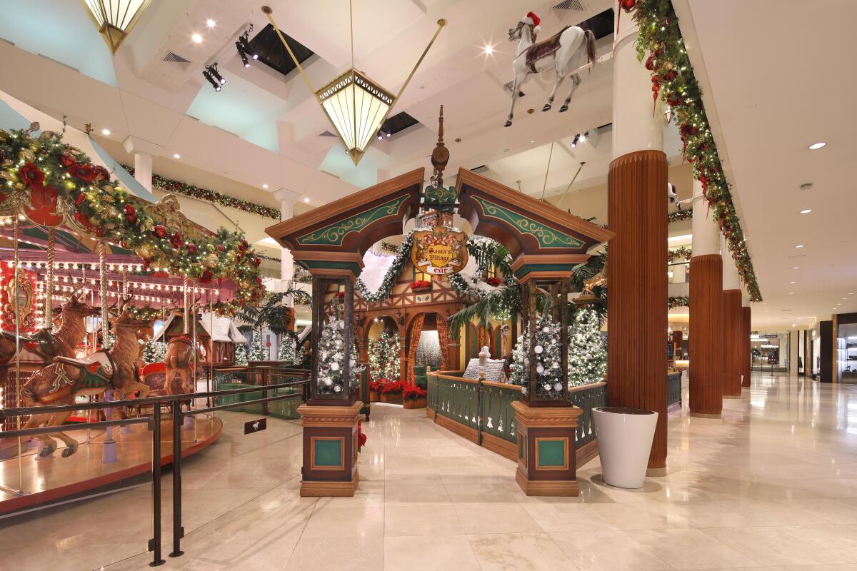 A mall interior filled with festive wintertime decorations