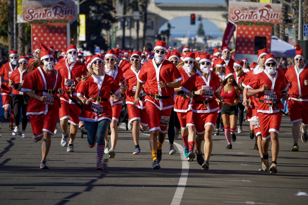 Thousands of Santas run through the streets of Pacific Beach The San