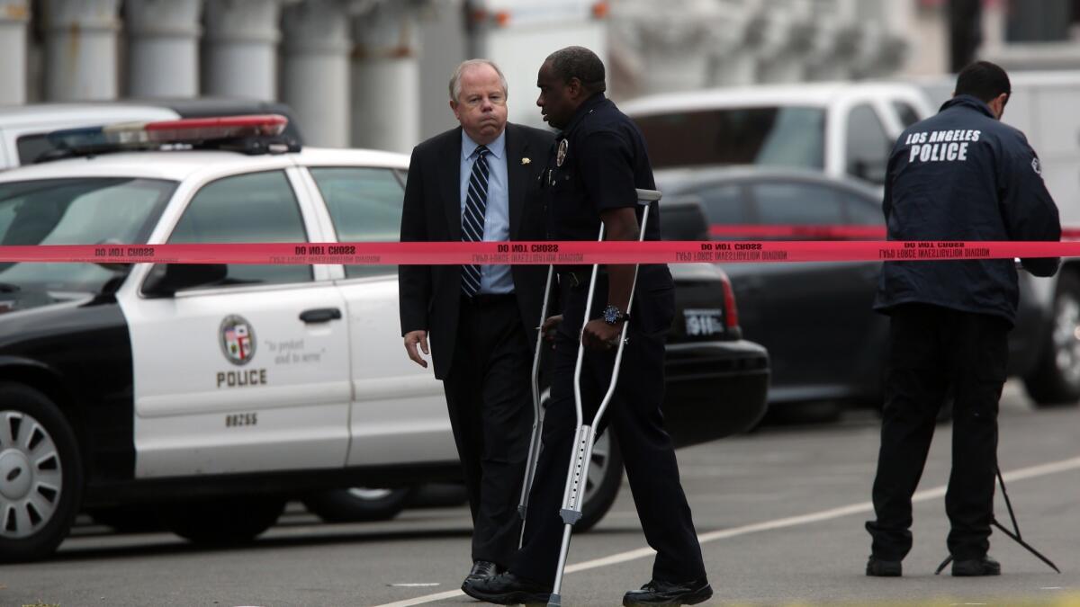 LAPD Officer Clifford Proctor uses crutches in Venice at the scene where he fatally shot Brendon Glenn, an unarmed homeless man, in 2015.