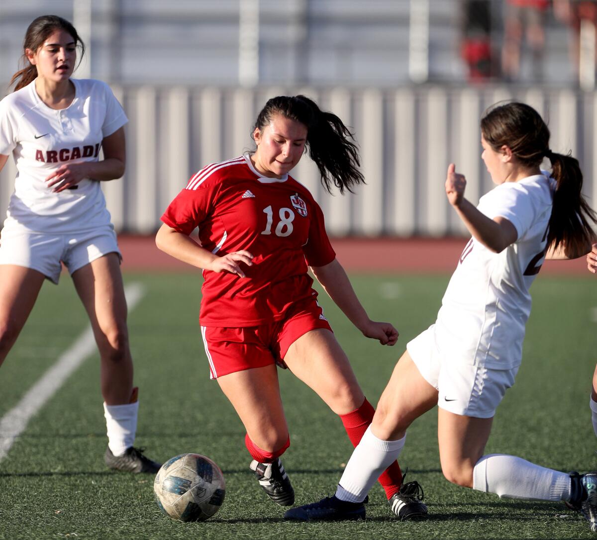Burroughs High's Viviana Medina, left, controls the ball during Tuesday's Pacific League match against Arcadia at Memorial Field.