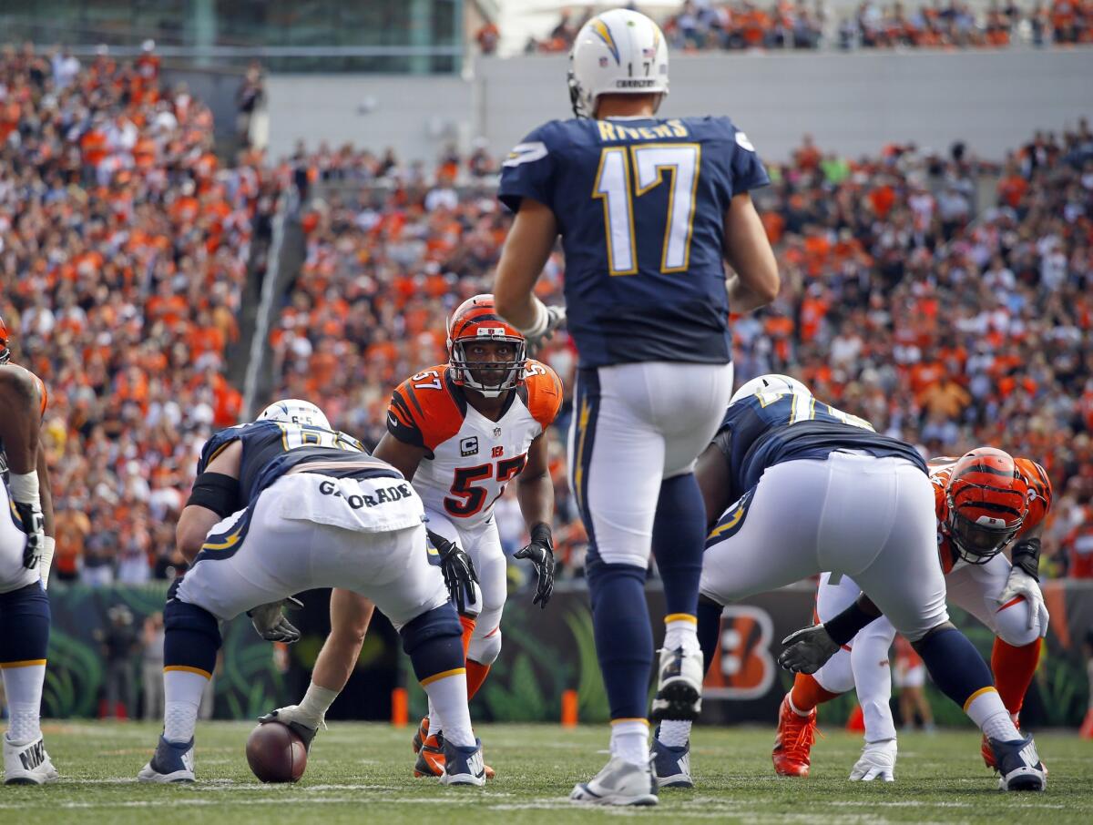 Chargers quarterback Philip Rivers signals with a lift of his leg.