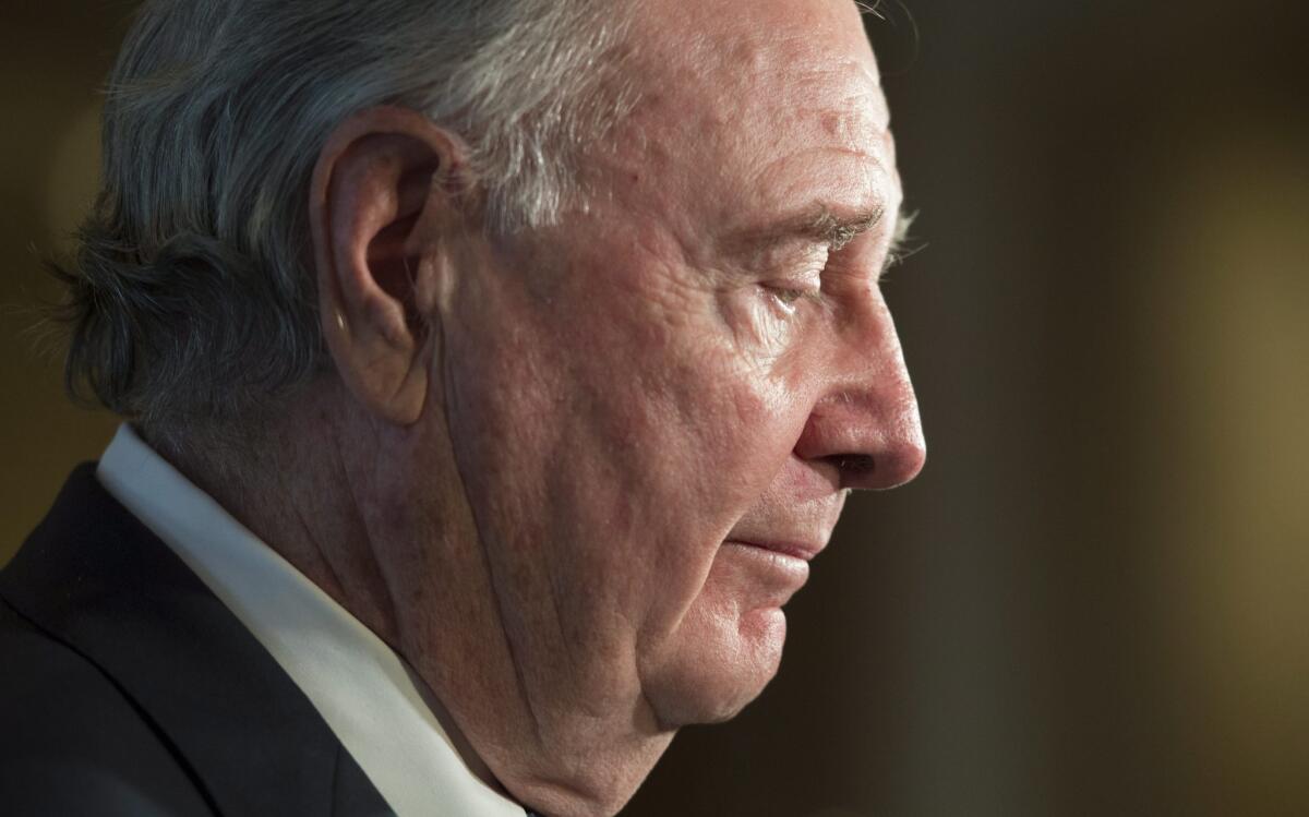 Former Canadian Prime Minister Paul Martin speaks with the media about former federal Cabinet minister and political commentator Jean Lapierre in Ottawa.