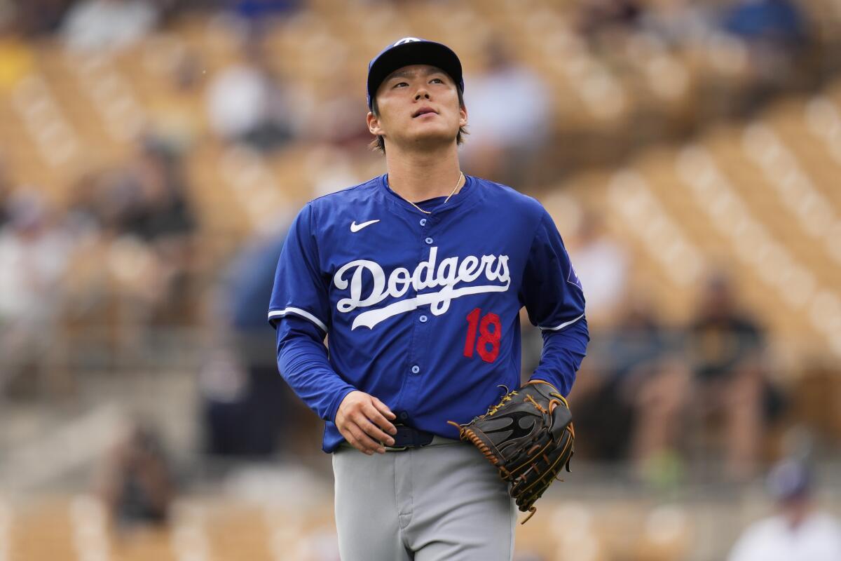 Dodgers pitcher Yoshinobu Yamamoto reacts after a single by the White Sox’s Dominic Fletcher during the first inning 
