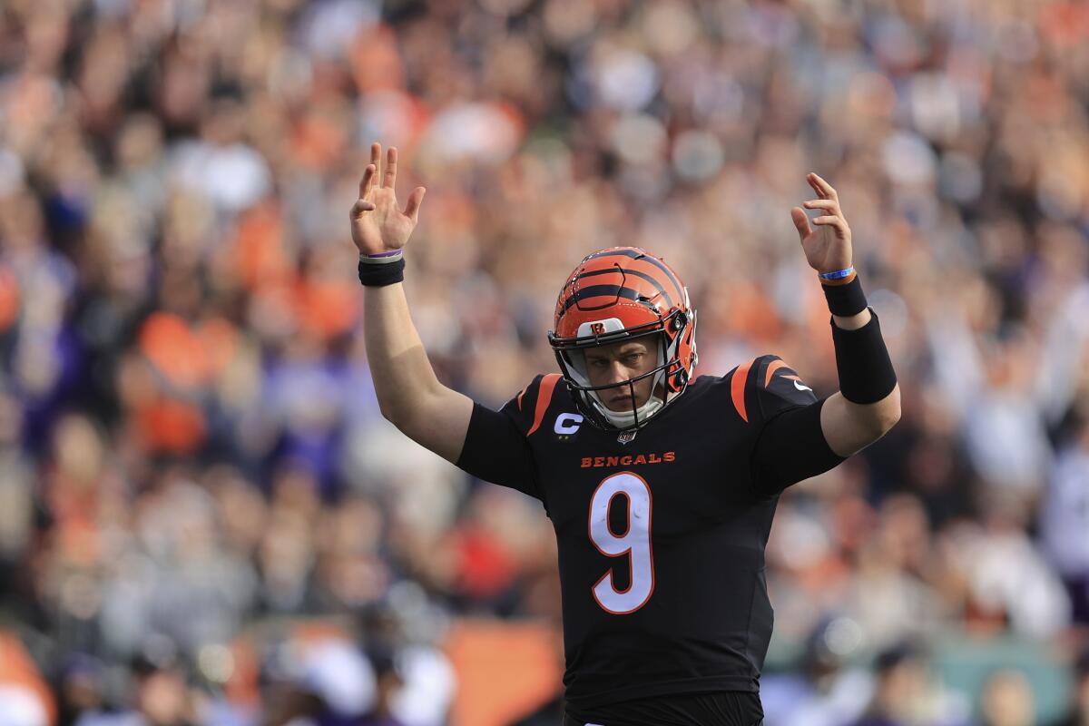 The Bengals' Joe Burrow throws up his hands.