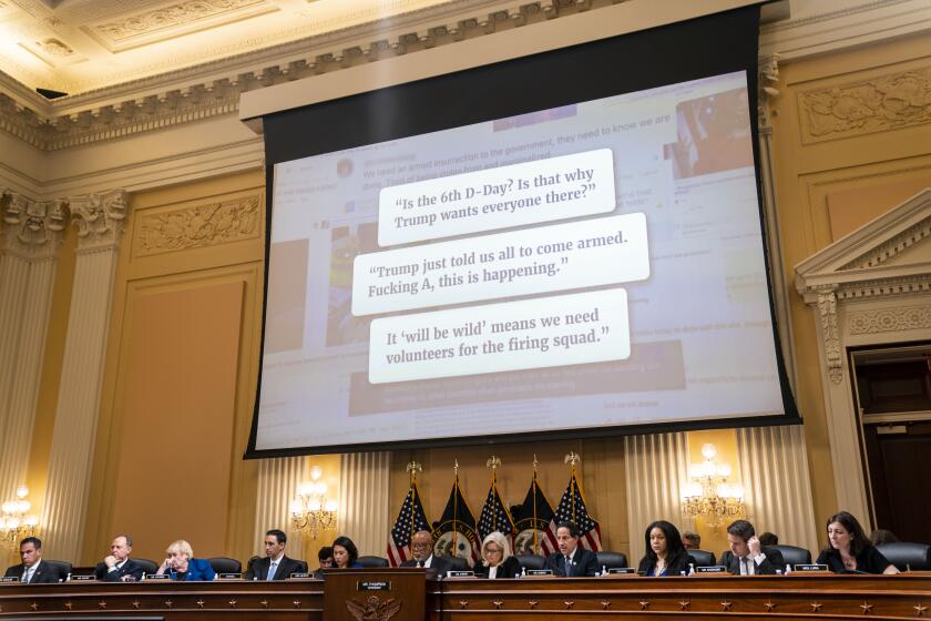 WASHINGTON, DC - JULY 12: Messages are displayed on screen during a House Select Committee to Investigate the January 6th Attack hearing in the Cannon House Office Building on Tuesday, July 12, 2022 in Washington, DC. The bipartisan Select Committee to Investigate the January 6th Attack On the United States Capitol has spent nearly a year conducting more than 1,000 interviews, reviewed more than 140,000 documents day of the attack. (Kent Nishimura / Los Angeles Times)