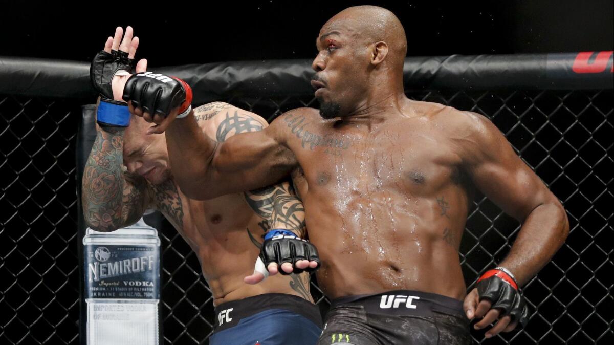 Jon Jones batters Anthony Smith in their light-heavyweight bout at UFC 235 in Las Vegas.