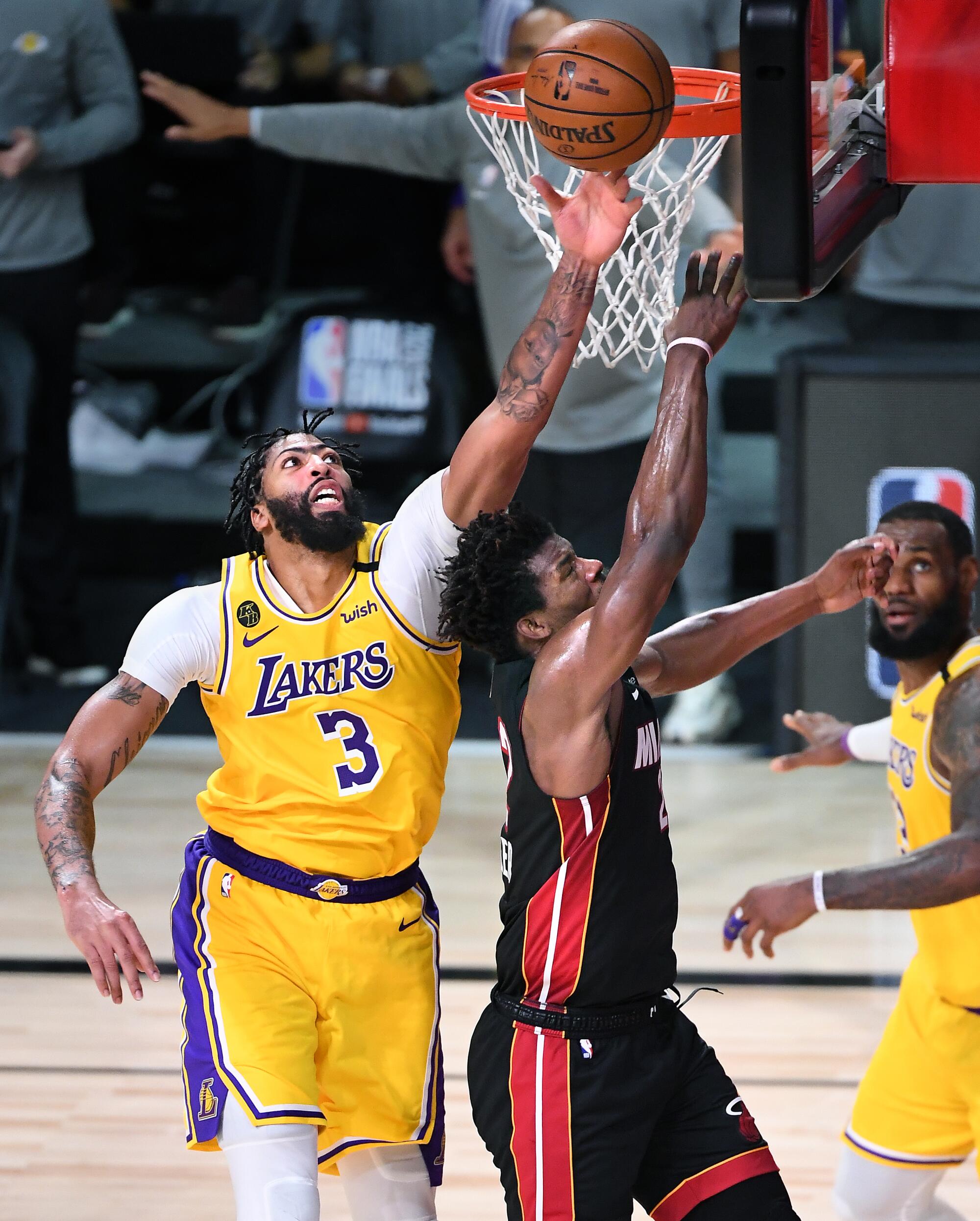 Lakers forward Anthony Davis blocks a layup by Heat forward Jimmy Butler late in Game 4.
