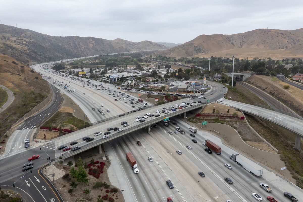 An aerial view of traffic on a freeway interchange