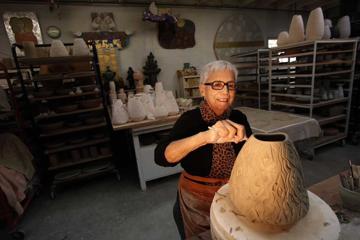 Dora De Larios works on a vase at Irving Place Studio in Los Angeles in 2014.