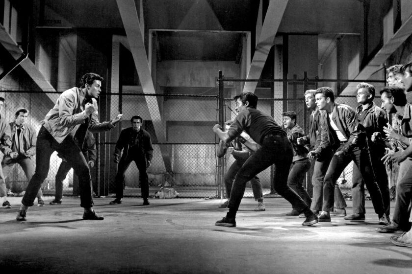 (Original Caption) 1961-Scene from "West Side Story," U.A. film: Gangwar dance scene in which both the leaders of the Jets and the Sharks are killed. LTR: Richard Beymer, George Chakaris, Russ Tamblyn. (Photo by George Rinhart/Corbis via Getty Images)