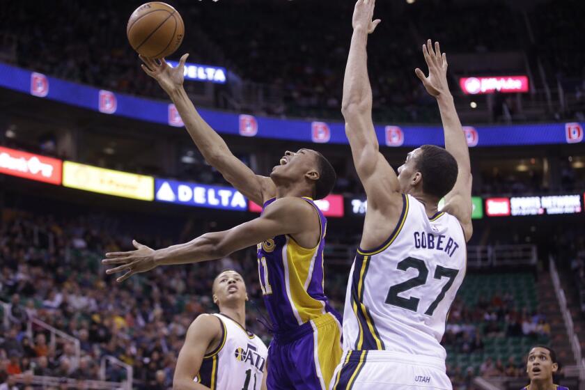 Wesley Johnson drives to the hoop against Utah center Rudy Gobert during the first quarter of a game Wednesday.