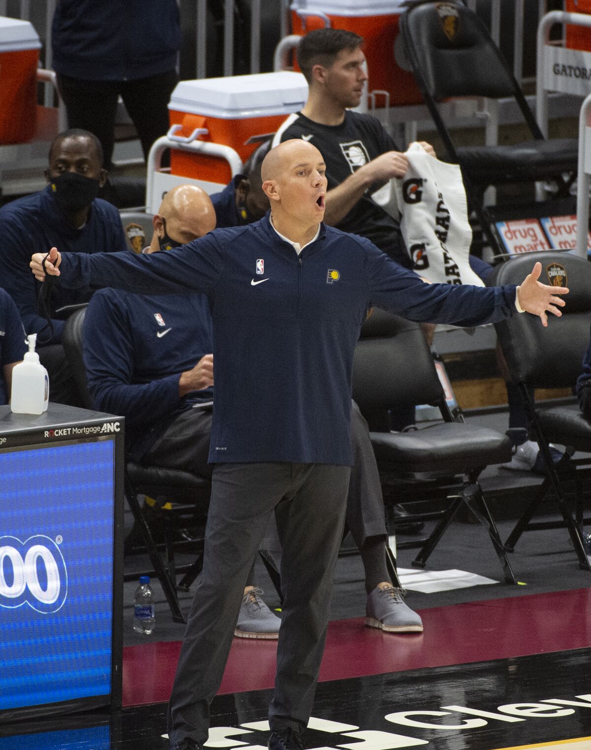 Indiana Pacers Head Coach Nate Bjorkgren calls to his team during the second half of an NBA preseason basketball game Monday, Dec. 14, 2020, in Cleveland. (AP Photo/Phil Long)