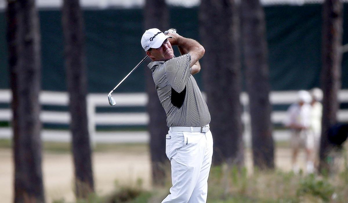 Fran Quinn hits an approach shot at No. 16 on Thursday during the first round of the U.S. Open.