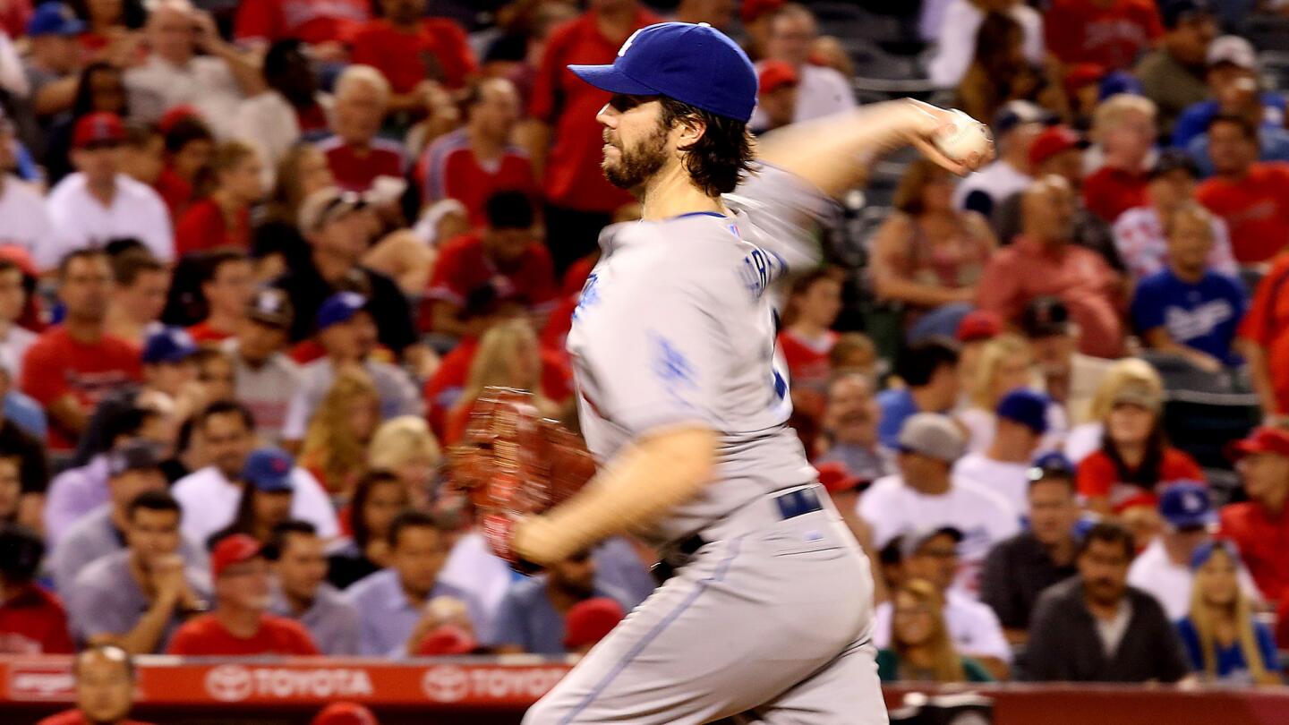 Dodgers starter Dan Haren delivers a pitch during the sixth inning of Wednesday's game against the Angels.