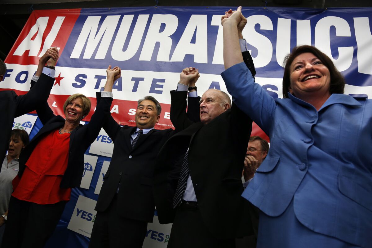 Former Assemblyman Al Muratsuchi, second to left, lost his seat to a Republican challenger in 2014 despite the backing of Democratic leaders and Gov. Jerry Brown. (Rick Loomis / Los Angeles Times)