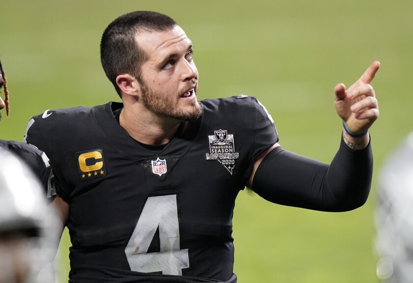 Las Vegas Raiders quarterback Derek Carr leaves the field after a loss to the Kansas City Chiefs on Sunday.