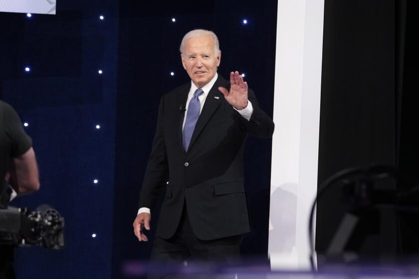 President Joe Biden gestures as he takes the stage at the start of a presidential debate against Republican presidential candidate former President Donald Trump, Thursday, June 27, 2024, in Atlanta. (AP Photo/Gerald Herbert)