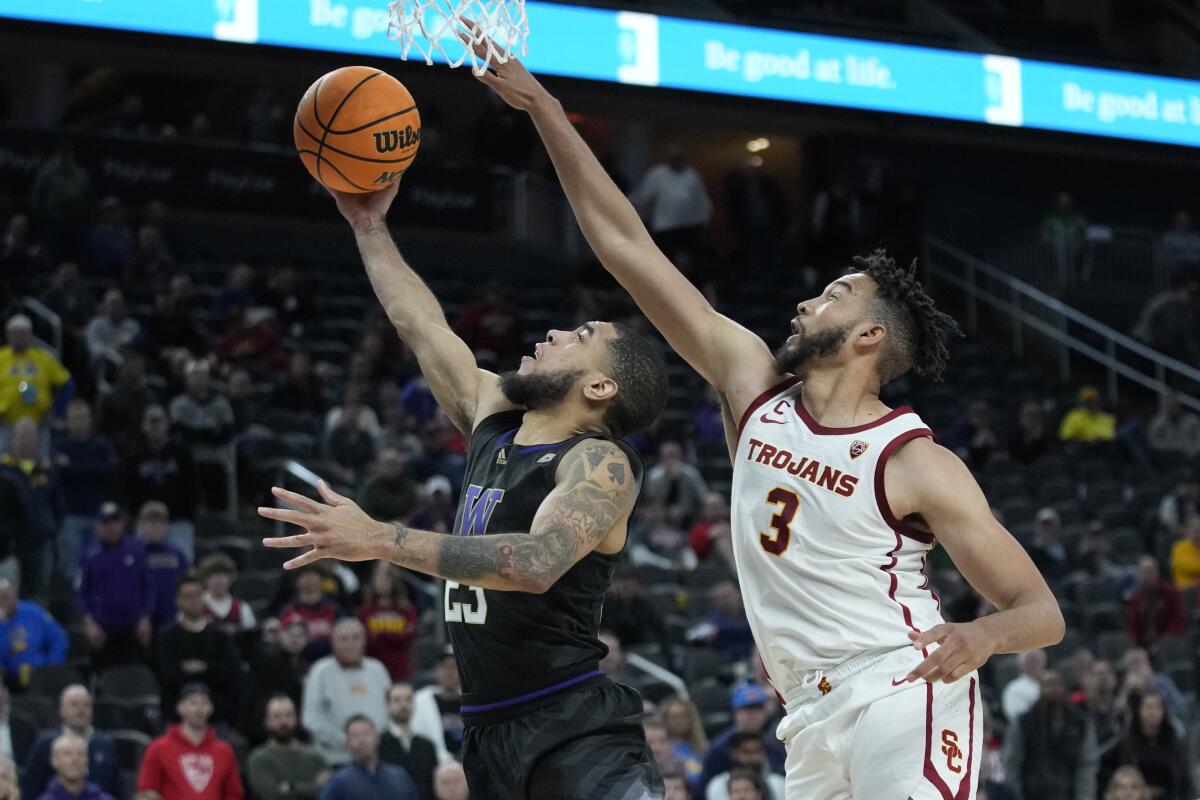 Washington's Terrell Brown Jr. shoots around USC's Isaiah Mobley.