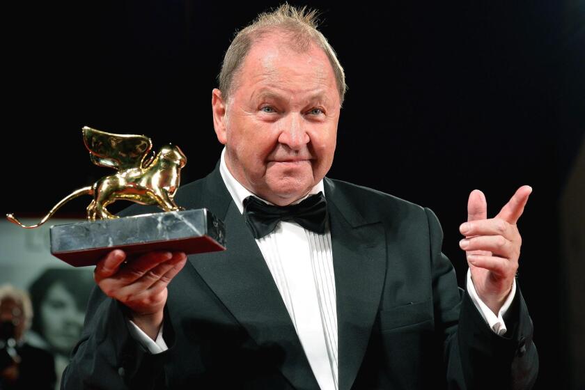 Swedish director Roy Andersson accepts the Golden Lion at the Venice Film Festival for his new film "A Pigeon Sat on a Branch Reflecting on Existence."