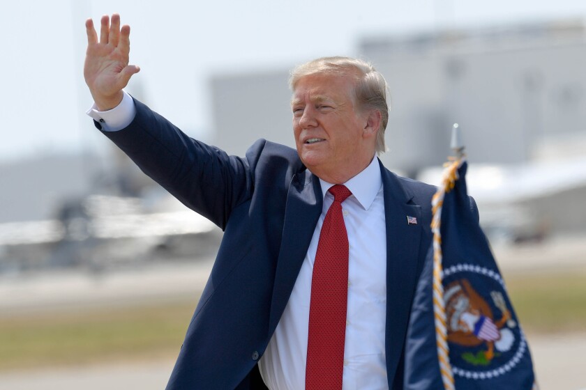 President Donald Trump waves to the crowd Louisville, Ky.