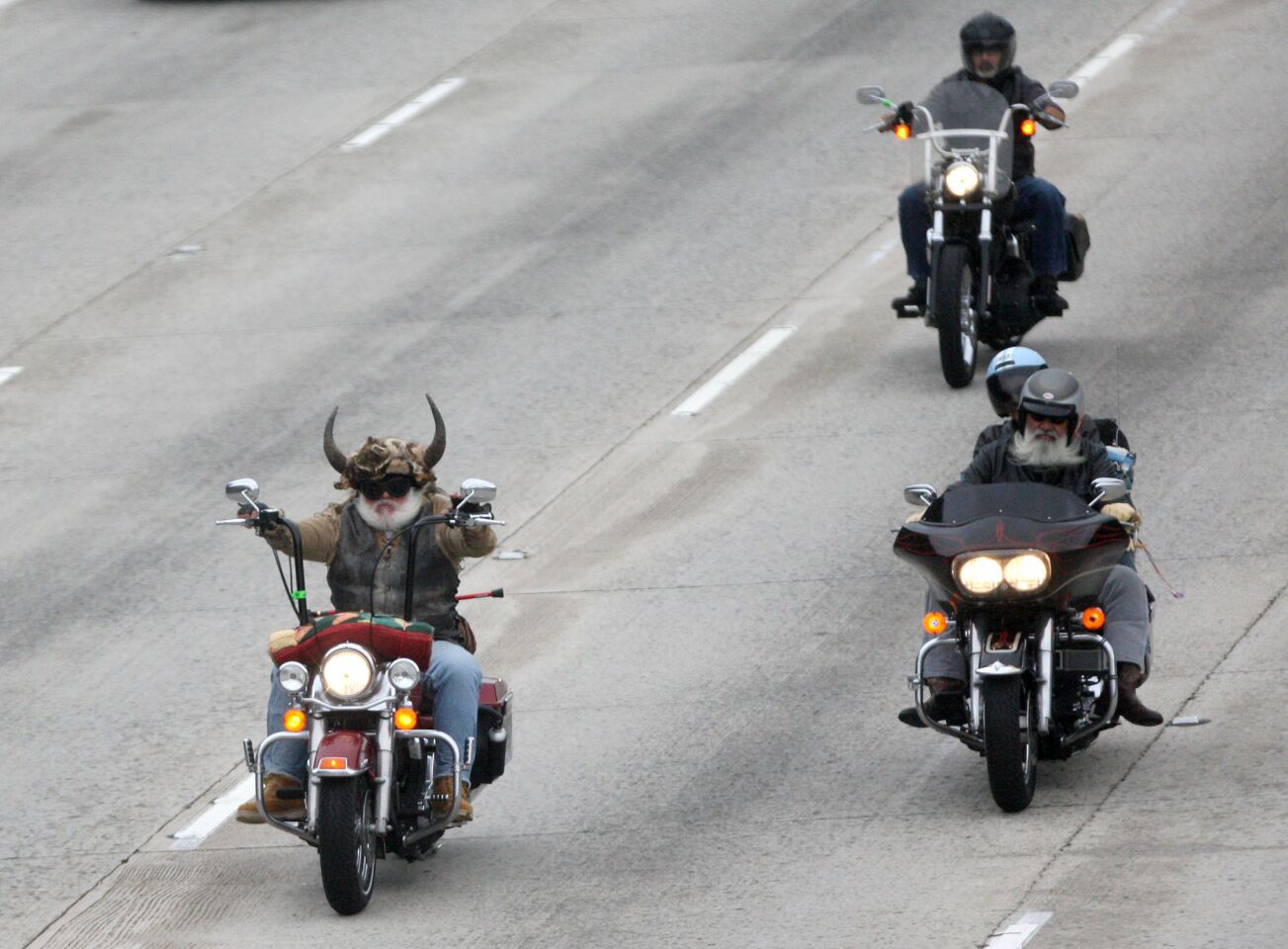 Wolf, from Sacramento, left, rides north of the Glendale Freeway towards the Foothill Freeway in the 32nd annual Love Ride event that began at Harley-Davidson Motorcycles in Glendale on Sunday, October 18, 2015. This will be the last fundraising Love Ride.