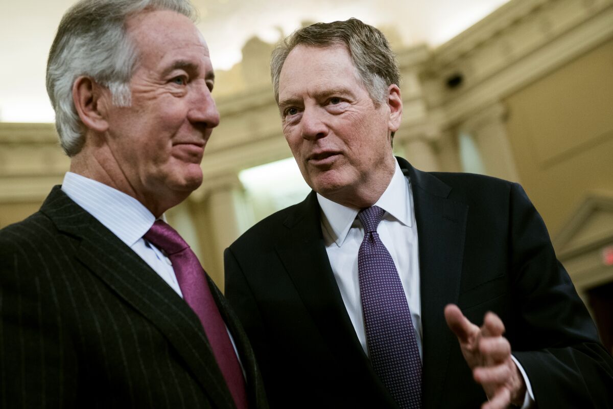 U.S. Trade Representative Robert E. Lighthizer, right, and House Ways and Means Chairman Richard Neal talk in February. Efforts are under way to wrap up negotiations on the replacement for NAFTA.