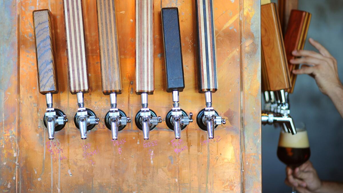 A beer is poured from one of the many taps at the Cannibal in Culver City.