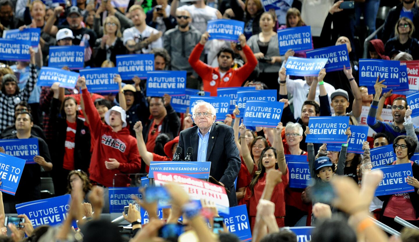 Bernie Sanders surrounded by campaign signs at StubHub Center in Carson.