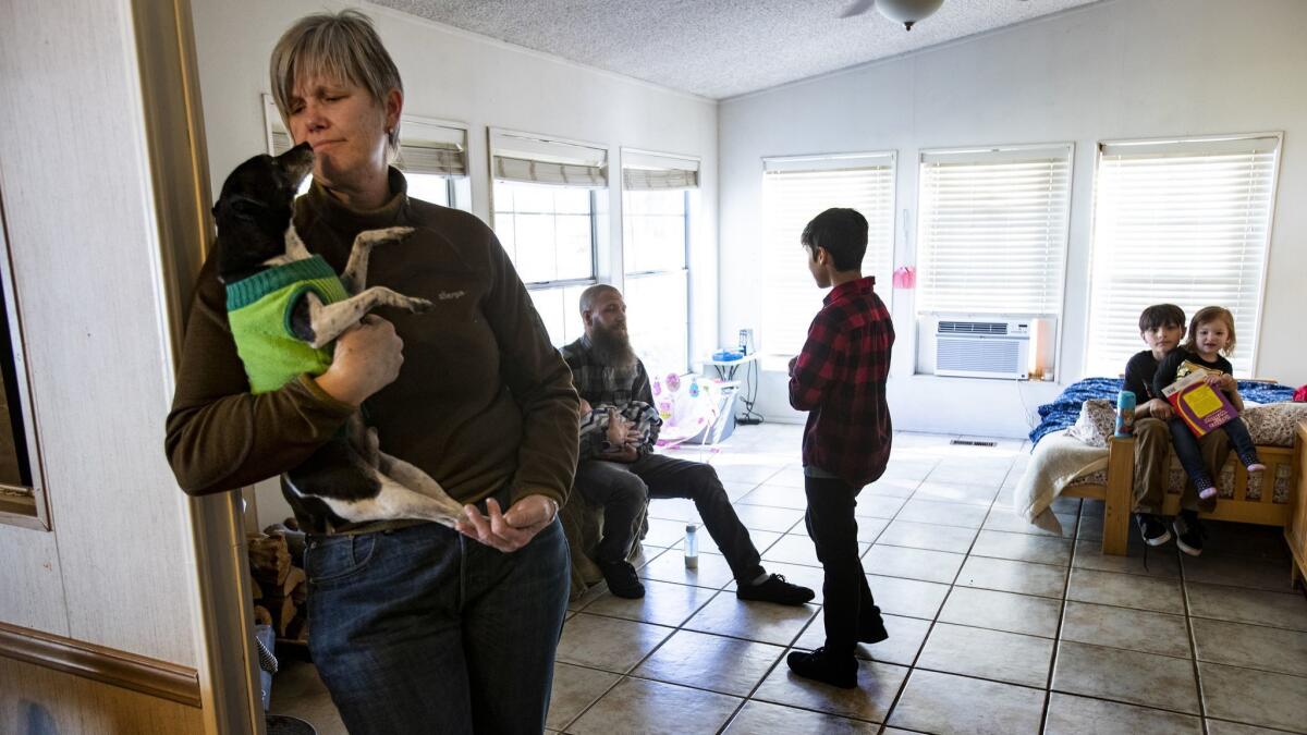 Gina Muse of Los Molinos, Calif., opened her home to the Wood family, who fled the Camp fire in Paradise.