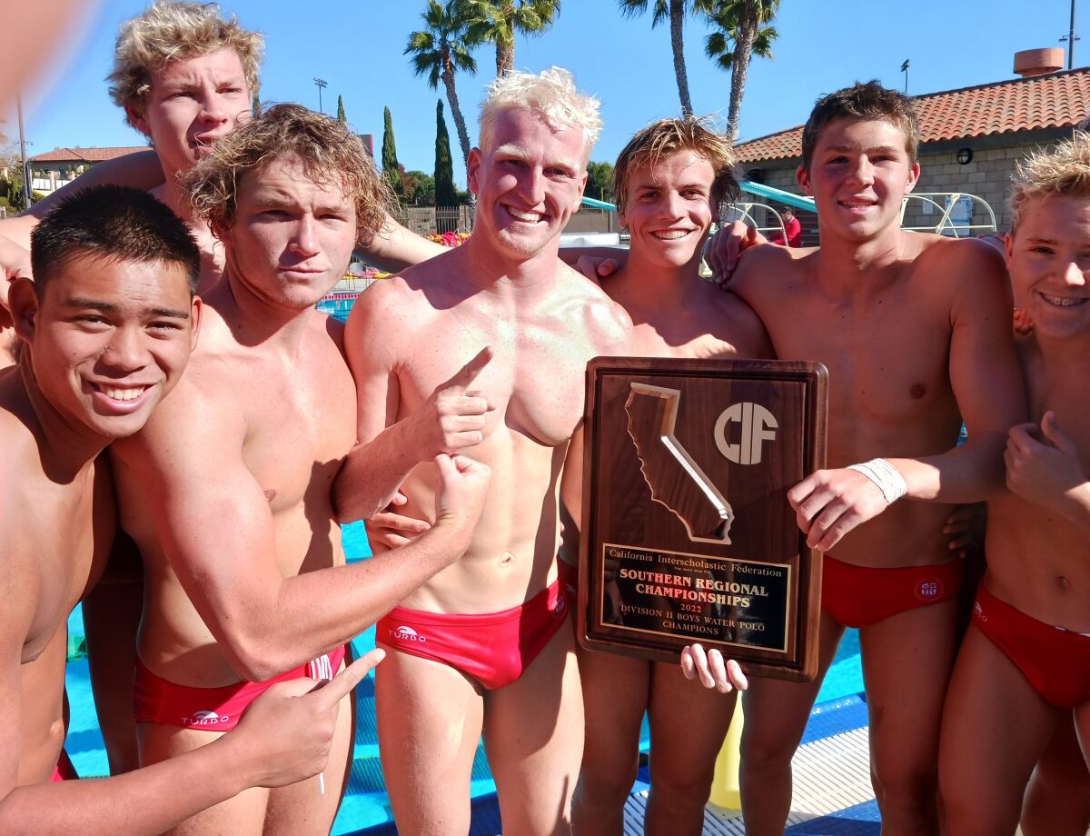 Cathedral Catholic senior Rick Lundh holds the Southern California Regional Division II boys water polo title plaque.