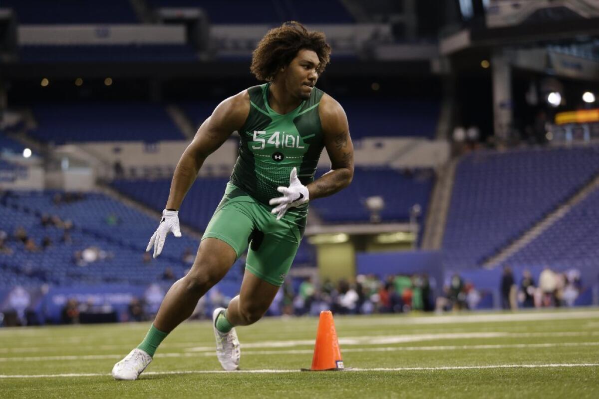 Former USC defensive end Leonard Williams takes part in a drill at the NFL scouting combine on Feb. 22.