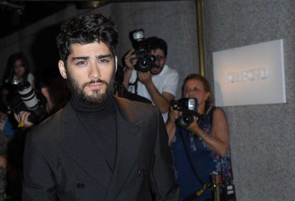 Zayn Malik, shown arriving at the Tom Ford show at New York Fashion Week on Sept. 7, is releasing an autobiography in November.