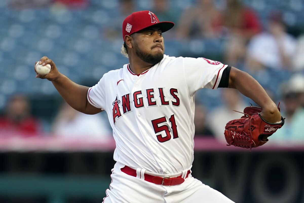 Angels pitcher Jaime Barria throws to the Texas Rangers.