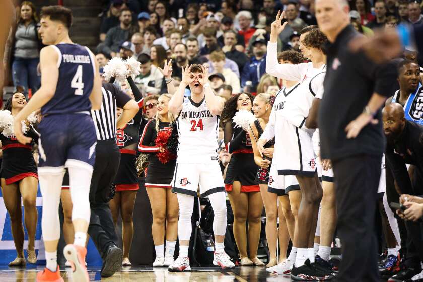 Spokane, WA - March 24: San Diego State guard Ryan Schwarz (24) celebrates a 3-point shot against Yale during the second round of the NCAA Tournament at Spokane Veterans Memorial Arena on Sunday, March 24, 2024 in Spokane, WA. (Meg McLaughlin / The San Diego Union-Tribune)