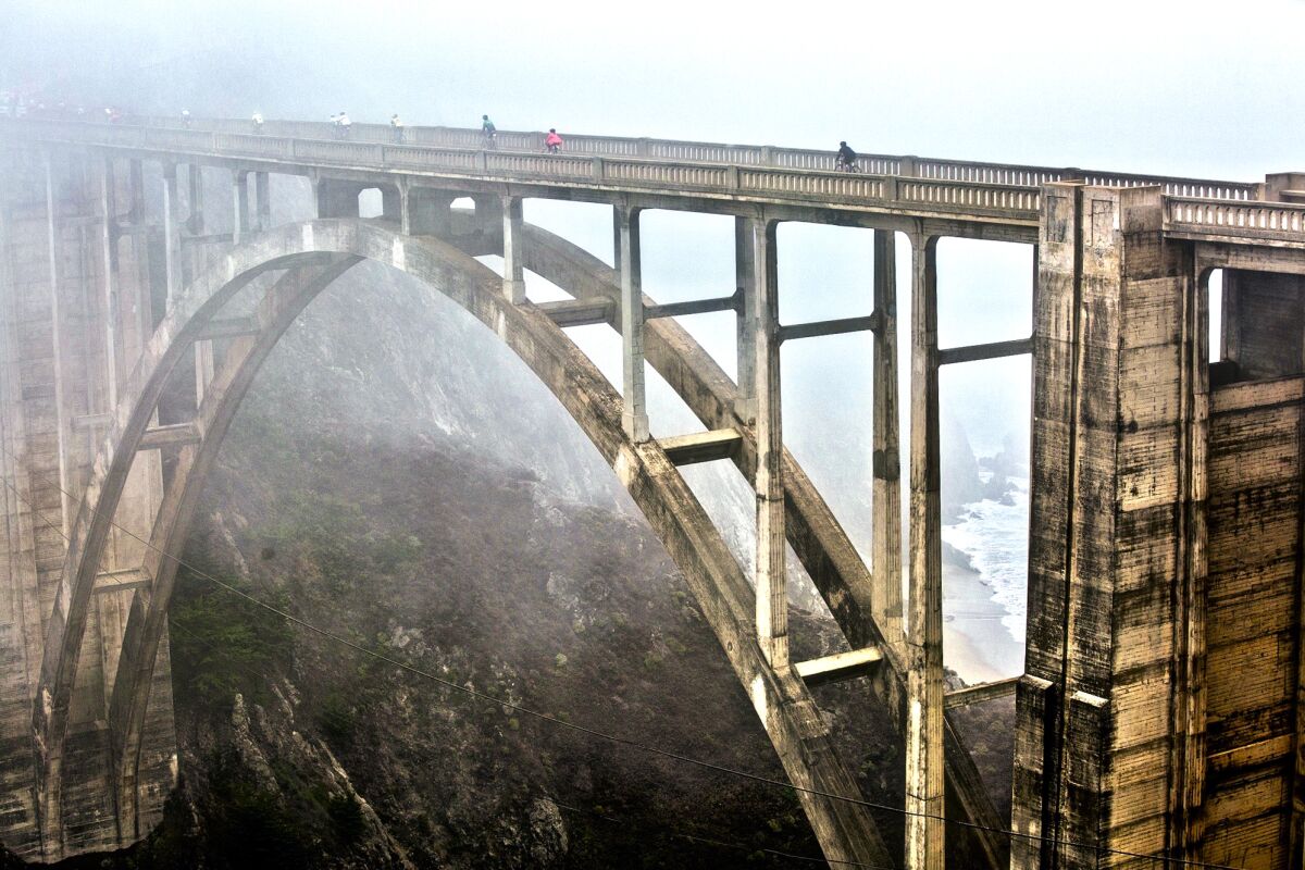 The Bixby Canyon Bridge, shrouded in fog, is on the coastal bike ride.