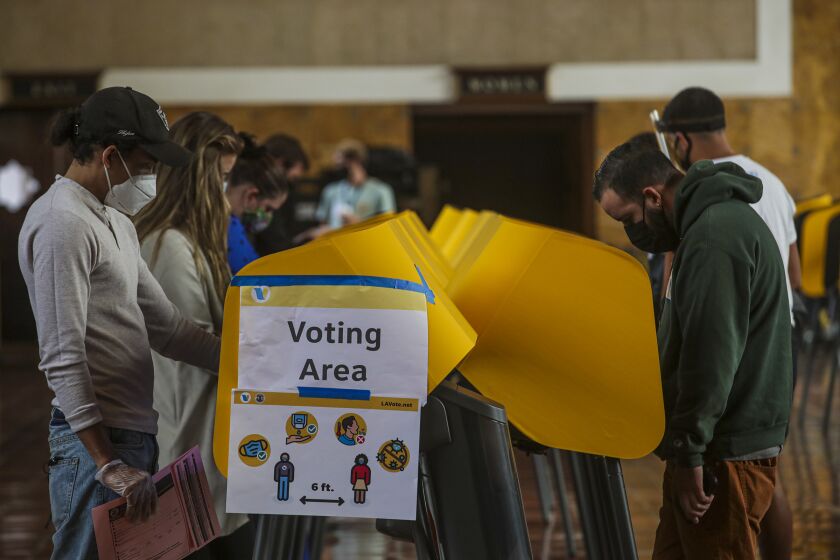 LOS ANGELES, CA - NOVEMBER 03: People voting at a polling station located at Union Station on Tuesday, Nov. 3, 2020 in Los Angeles, CA. (Irfan Khan / Los Angeles Times)