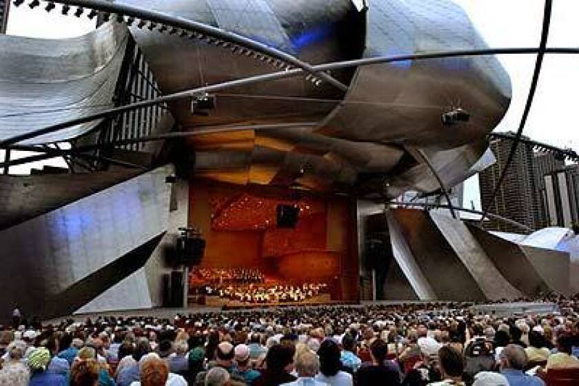 SIGHT AND SOUND: Forming the centerpiece of Chicago's newly refurbished Millennium Park is Frank Gehry's band shell. The park's whimsical art and architecture includes Jaume Plensa's Crown Fountain, a massive video installation.