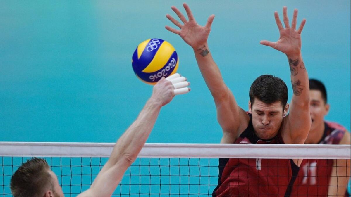 U.S. outside hitter Matt Anderson goes up for a block during a semifinal match against Italy on Aug. 19.