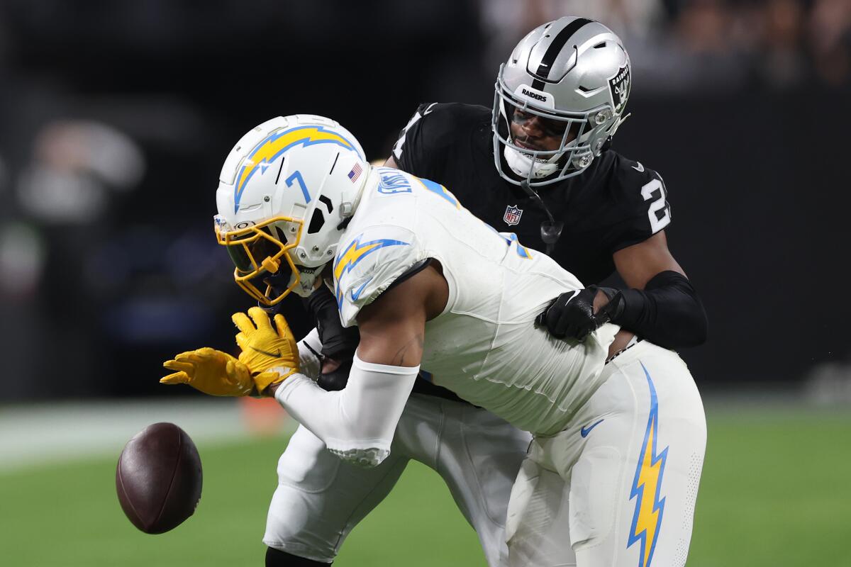 Las Vegas Raiders Cornerback Amik Robertson and Chargers' Gerald Everett at Las Vegas' Allegiant Stadium on Dec. 14. 