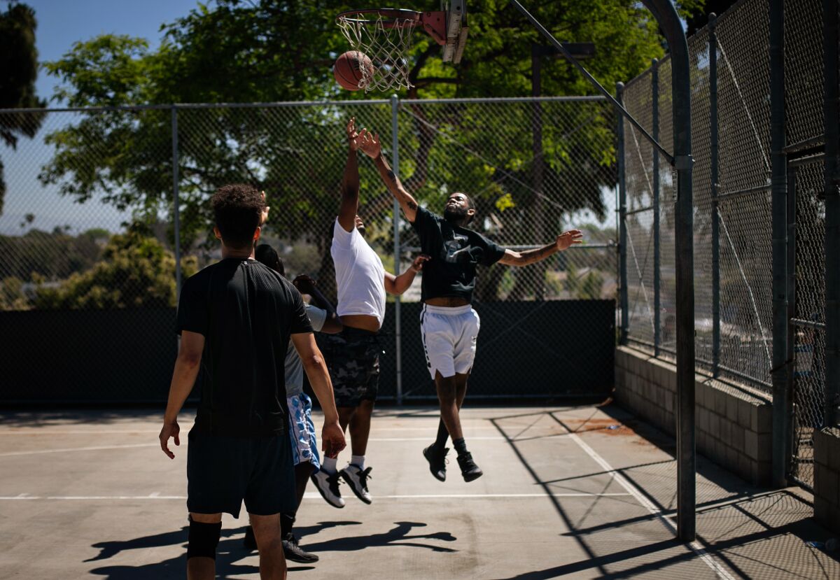 John Wall goes up for a rebound during a weekly game of pick-up basketball in Santa Monica's Joslyn Park. 