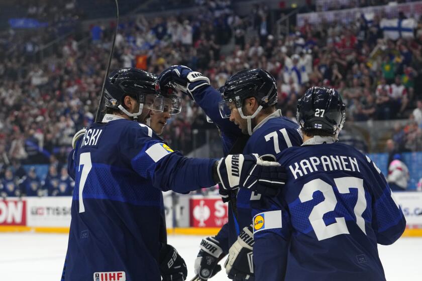 Finland's Oliver Kapanen, right, celebrates with teammates after scoring his sides first goal during the preliminary round match between Finland and Great Britain at the Ice Hockey World Championships in Prague, Czech Republic, Sunday, May 12, 2024. (AP Photo/Petr David Josek)