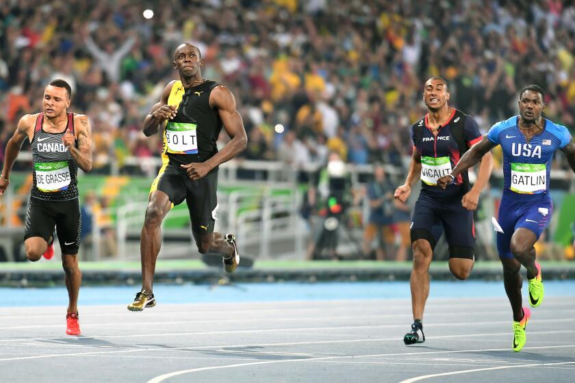Jamaica sprinter Usain Bolt, second from left, beats from left, Canada's Andre deGrasse, France's Kimmy Vicaut and USA's Justin Gatlin for the gold medal in the 100 meters.