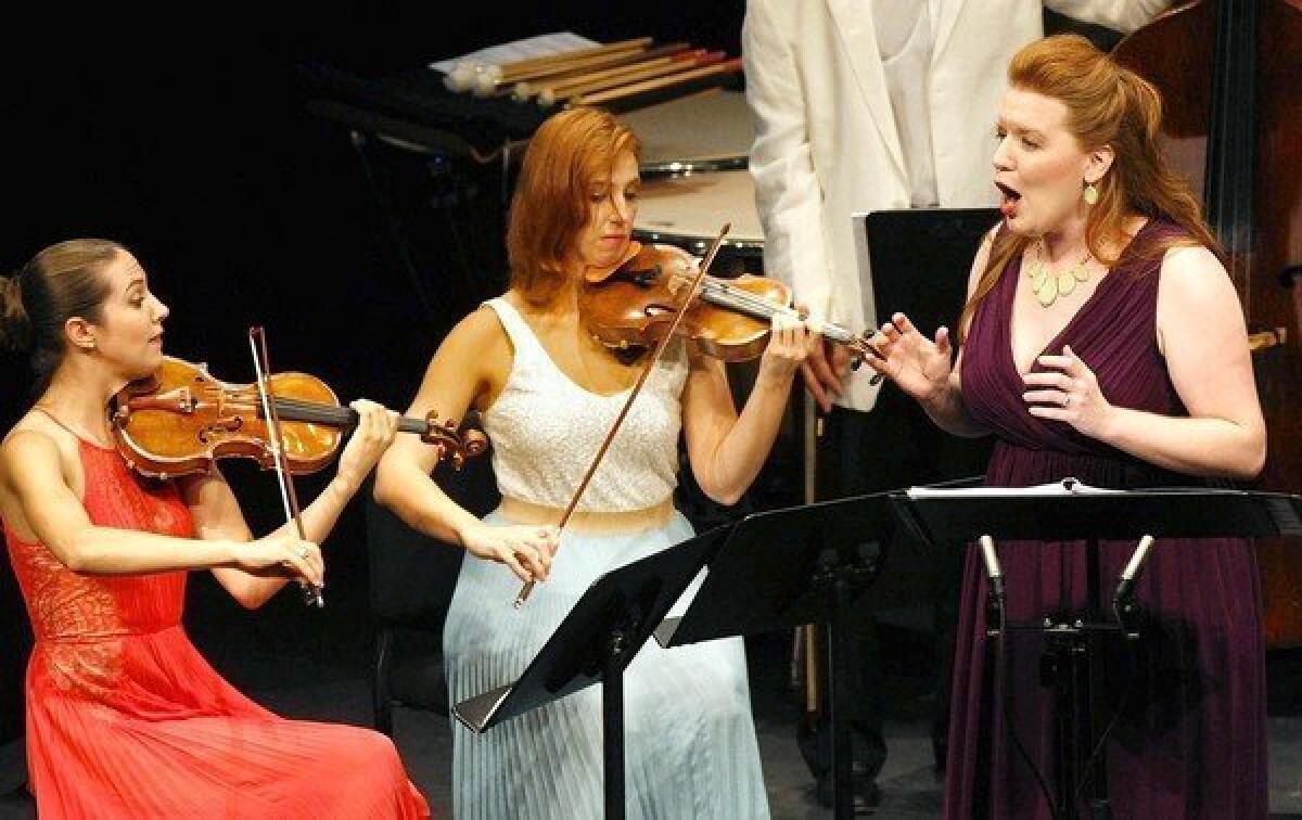 Meso-soprano Jennifer Johnson Cano performs the world premiere of John Harbison's, Crossroads with violinists Sarah McElravy, left, and Catherine Cosbey at the Summerfest 2013 in Sherwood Auditorium, La Jolla, on Aug. 16, 2013.
