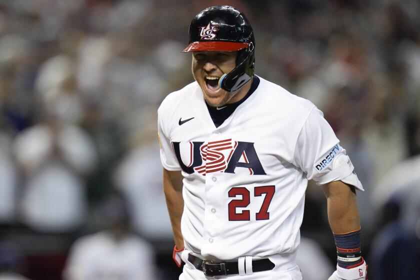 United States' Mike Trout celebrates his three-run home run against Canada during the first inning.