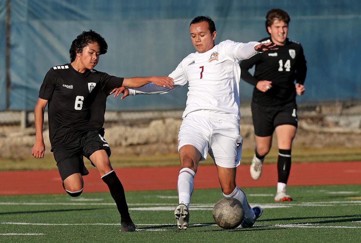 Ocean View's Jesus Esparza (7) battles against Marina's Pedro Flores (6) in a nonleague match on Friday.